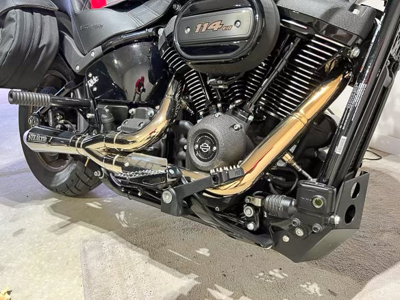 Stealth Pipes exhaust system installed on Harley M8 Softail – rear-side view of muffler and headers (2017–2025)