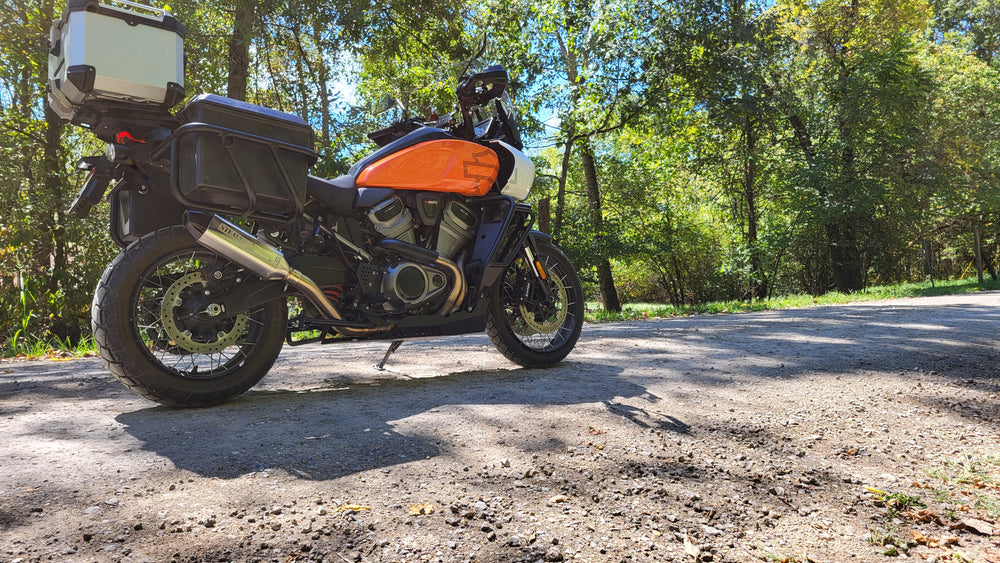 Harley Pan America front angle showing Stealth Pipes slip-on exhaust – polished stainless finish