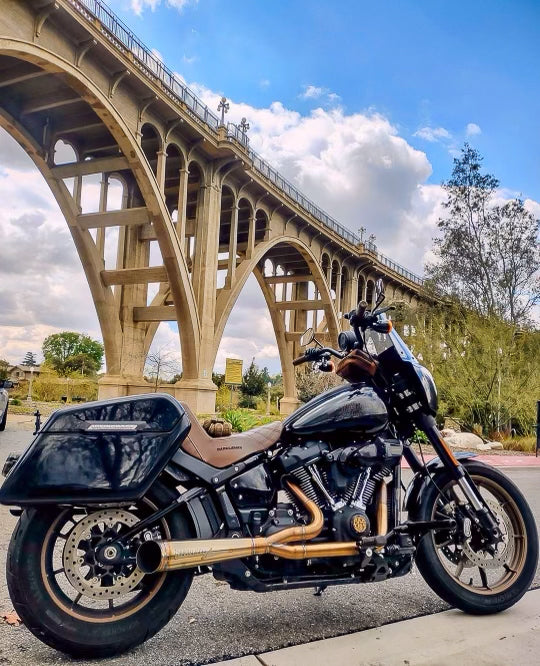 Stealth Pipes exhaust system installed on Harley M8 Softail – rear-side view of muffler and headers (2017–2025)