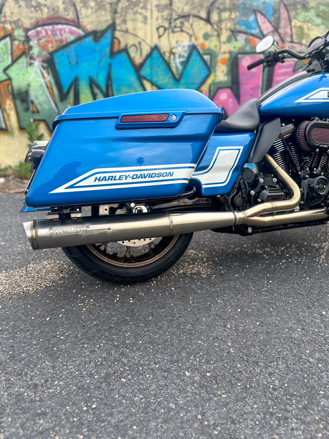Harley bagger motorcycle with Stealth Pipes full length muffler installed – American-made stainless exhaust upgrade