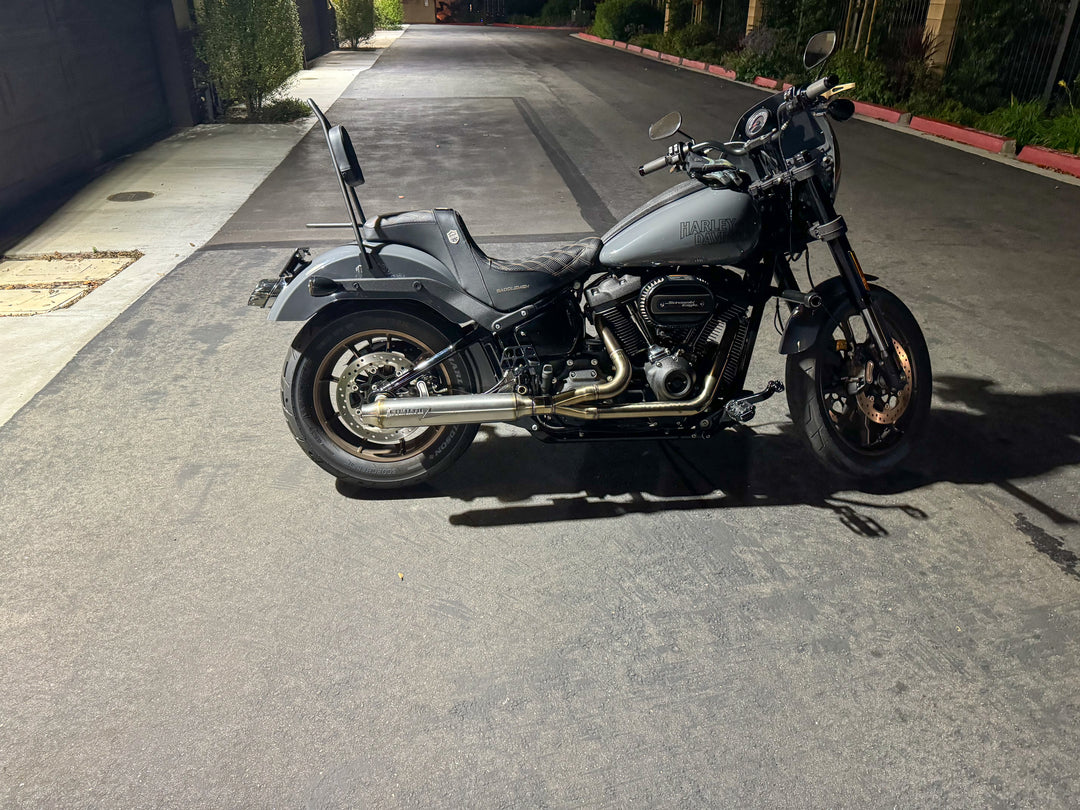 Stealth Pipes exhaust system installed on Harley M8 Softail – rear-side view of muffler and headers (2017–2025)