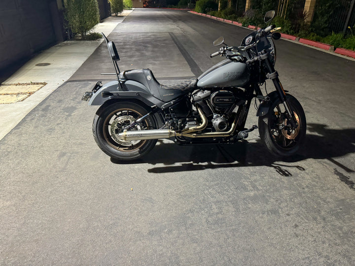 Stealth Pipes exhaust system installed on Harley M8 Softail – rear-side view of muffler and headers (2017–2025)