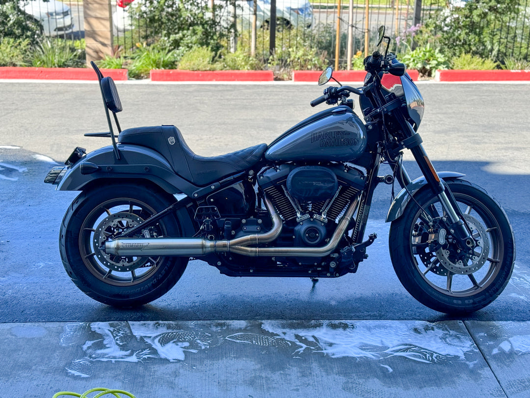 Stealth Pipes exhaust system installed on Harley M8 Softail – rear-side view of muffler and headers (2017–2025)