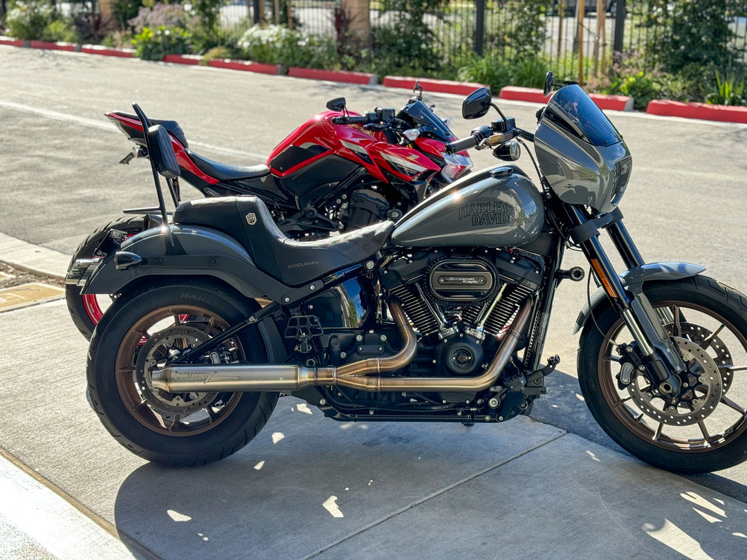 Stealth Pipes exhaust system installed on Harley M8 Softail – rear-side view of muffler and headers (2017–2025)