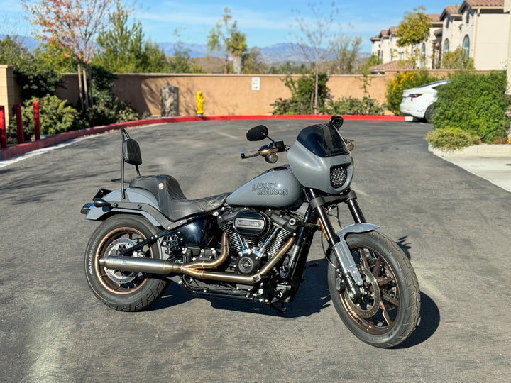 Stealth Pipes exhaust system installed on Harley M8 Softail – rear-side view of muffler and headers (2017–2025)