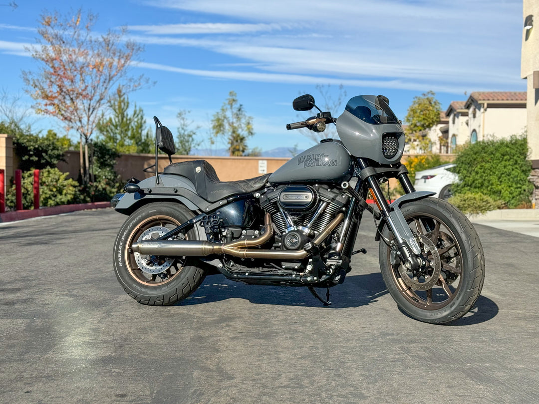 Stealth Pipes exhaust system installed on Harley M8 Softail – rear-side view of muffler and headers (2017–2025)