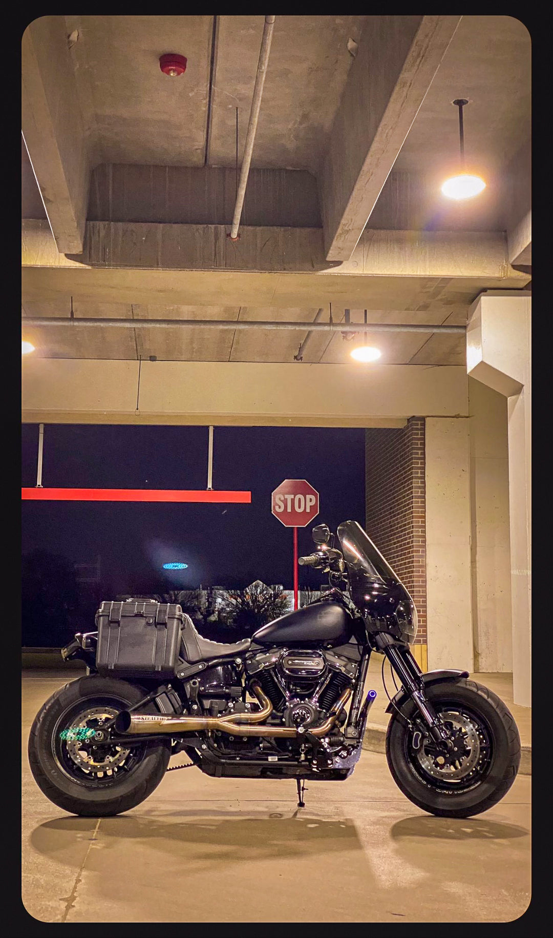 Stealth Pipes exhaust system installed on Harley M8 Softail – rear-side view of muffler and headers (2017–2025)