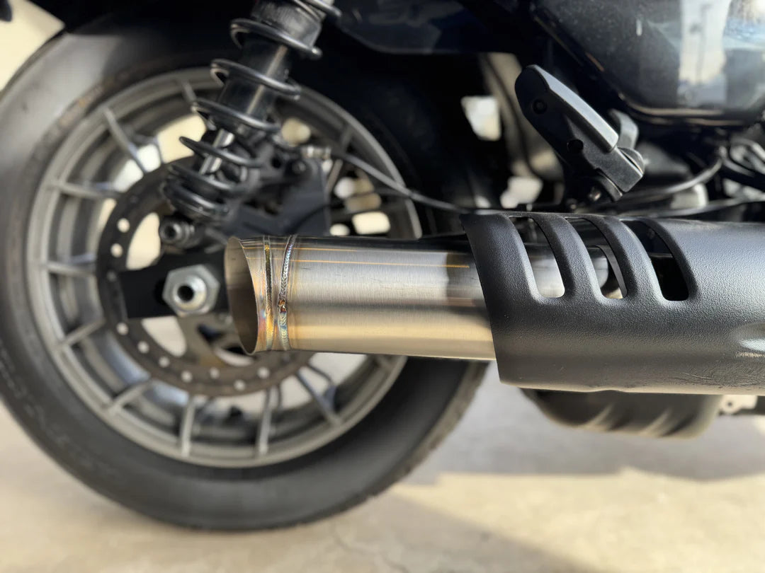Slip-on muffler exhaust system for a Harley Davidson Nightster, made of stainless steel, installed on a motorcycle