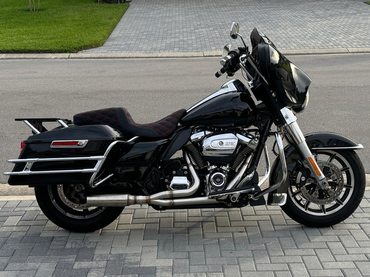 Stealth Pipes Breacher muffler on Harley motorcycle – rear angle showing stainless exhaust upgrade