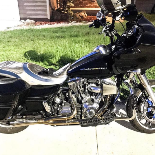 Stealth Pipes Short Bagger exhaust system – close-up rider side view on Harley touring motorcycle (1996–2016)