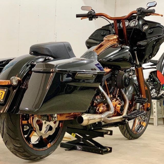 Stealth Pipes Short Bagger exhaust system – close-up rider side view on Harley touring motorcycle (1996–2016)