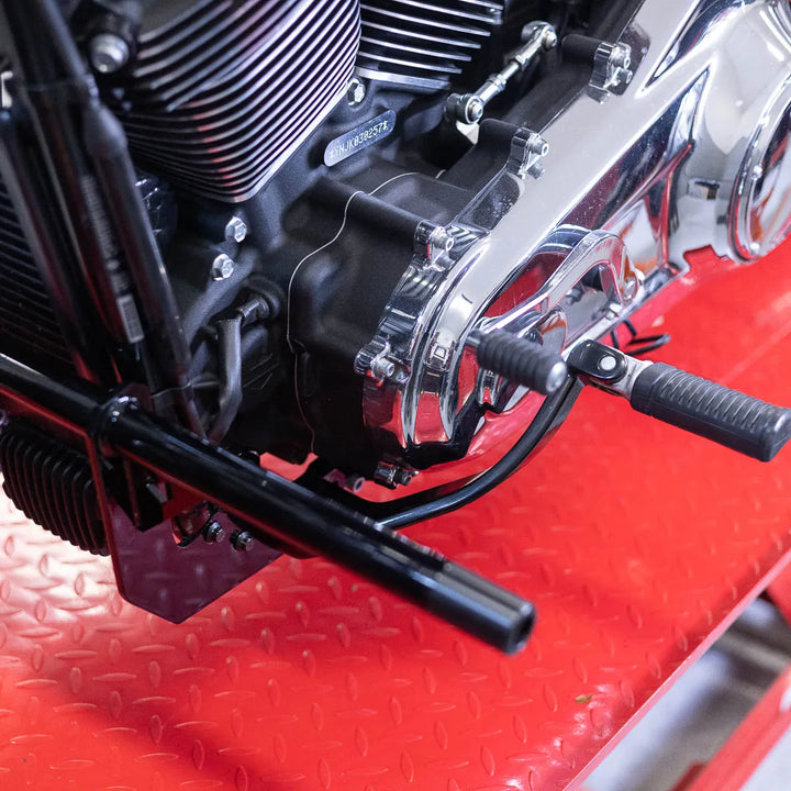 A black Softail Front Crash Bar designed for motorcycles, displayed installed on motorcycle.