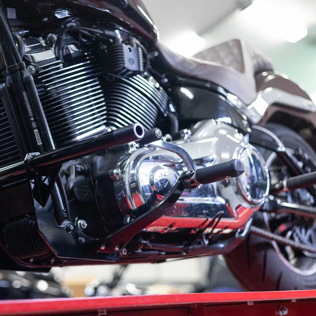 A black Softail Front Crash Bar designed for motorcycles, displayed installed on motorcycle.