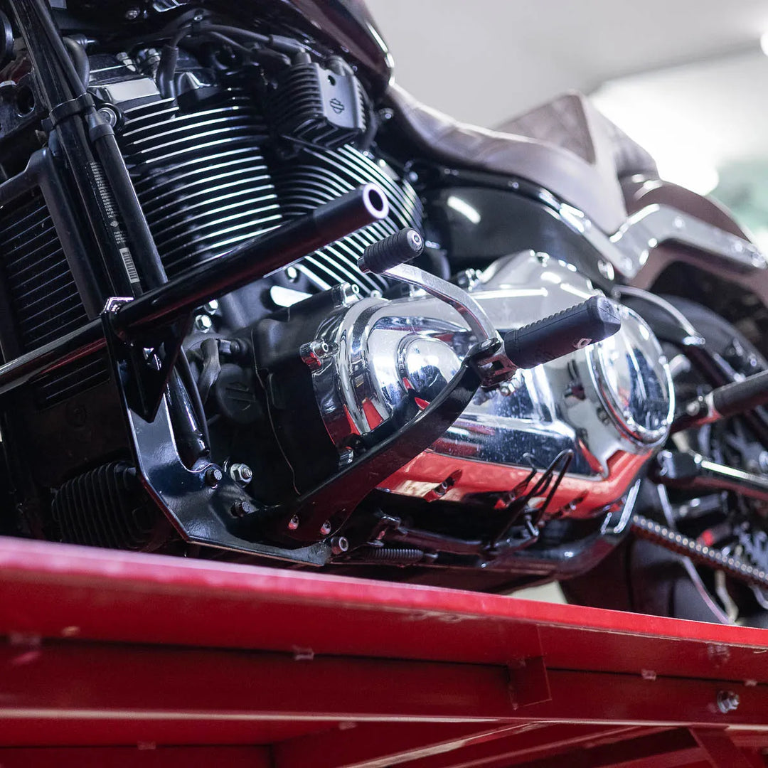 A black Softail Front Crash Bar designed for motorcycles, displayed installed on motorcycle.