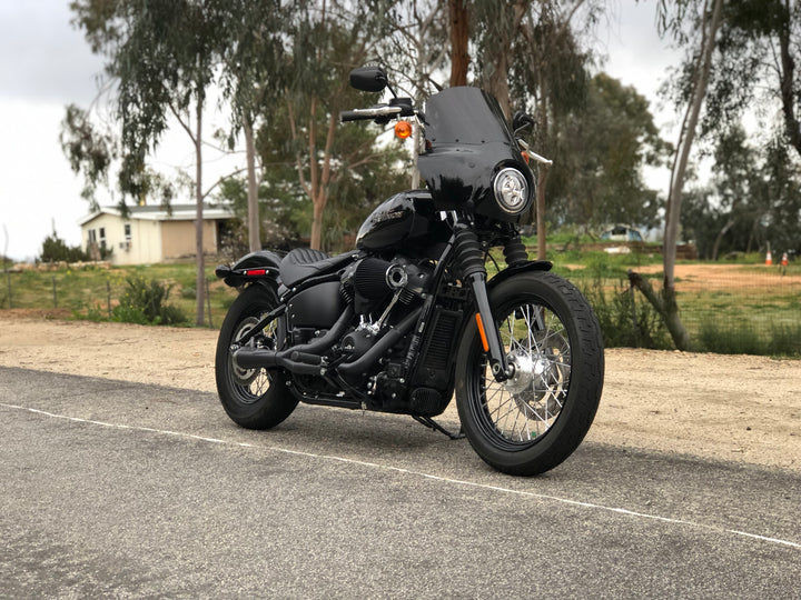 Stealth Pipes exhaust system installed on Harley M8 Softail – front-side view of muffler and headers (2017–2025)