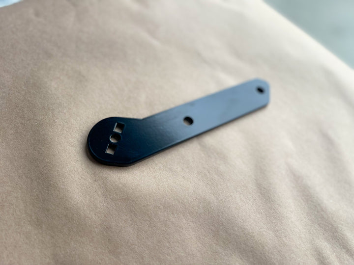 Lowrider ST Baggage Support Bracket – Stealth Pipes black bracket for Harley M8 Softail fitment