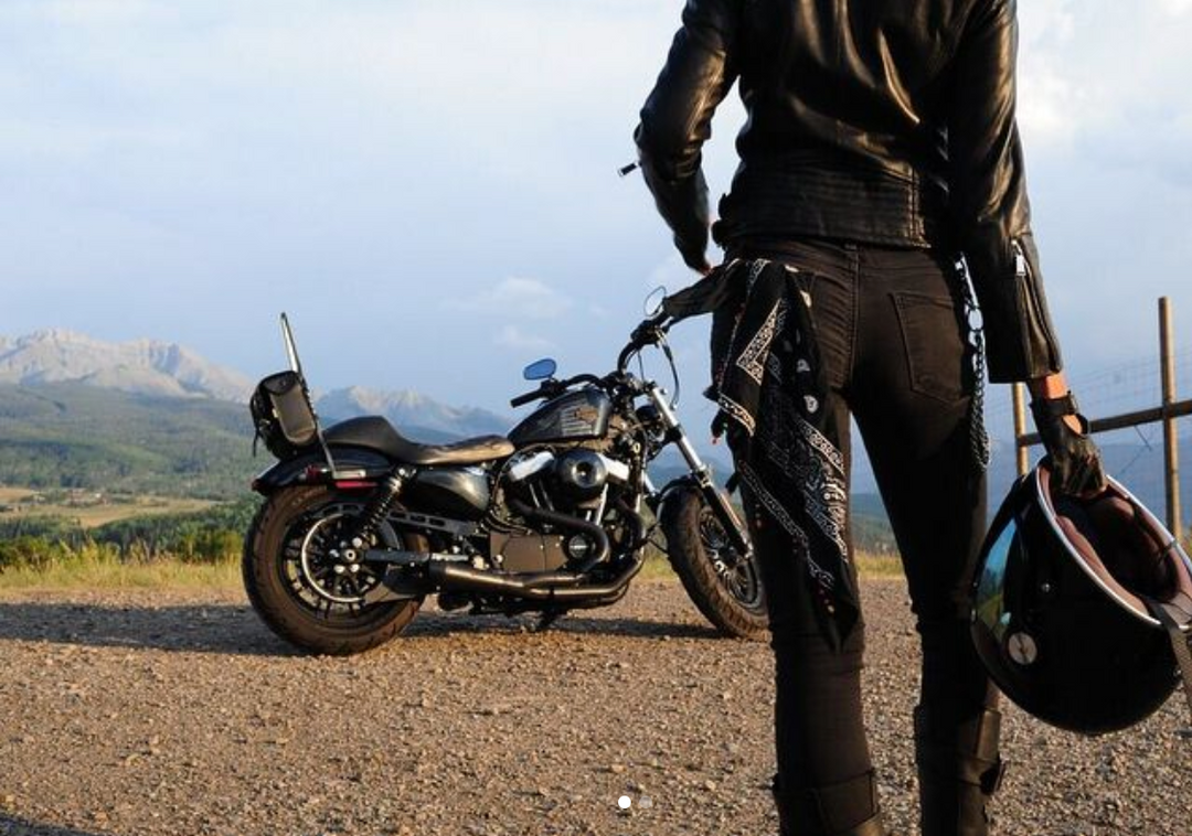 Harley Sportster motorcycle with Stealth Pipes exhaust – rider-side lifestyle photo