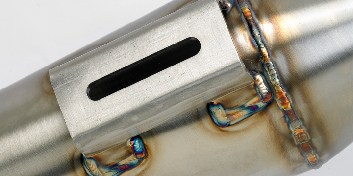 Close-up of Stealth Pipes Reverse Cone Muffler – TIG weld detail and engraved logo