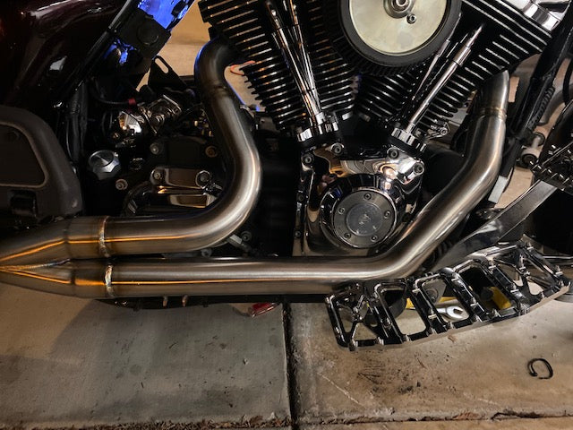Stealth Pipes Short Bagger exhaust system – close-up rider side view on Harley touring motorcycle (1996–2016)