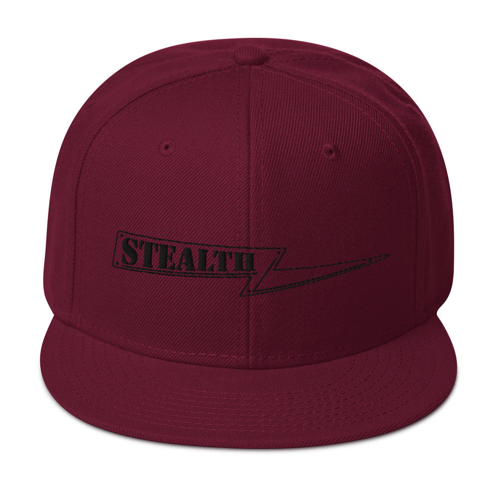 Burgundy Stealth Pipes snapback hat with structured crown and grey under visor